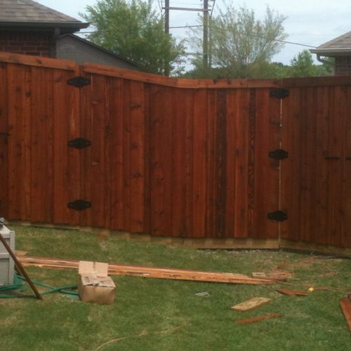 fence replacement - this is a 6' cedar board on bo