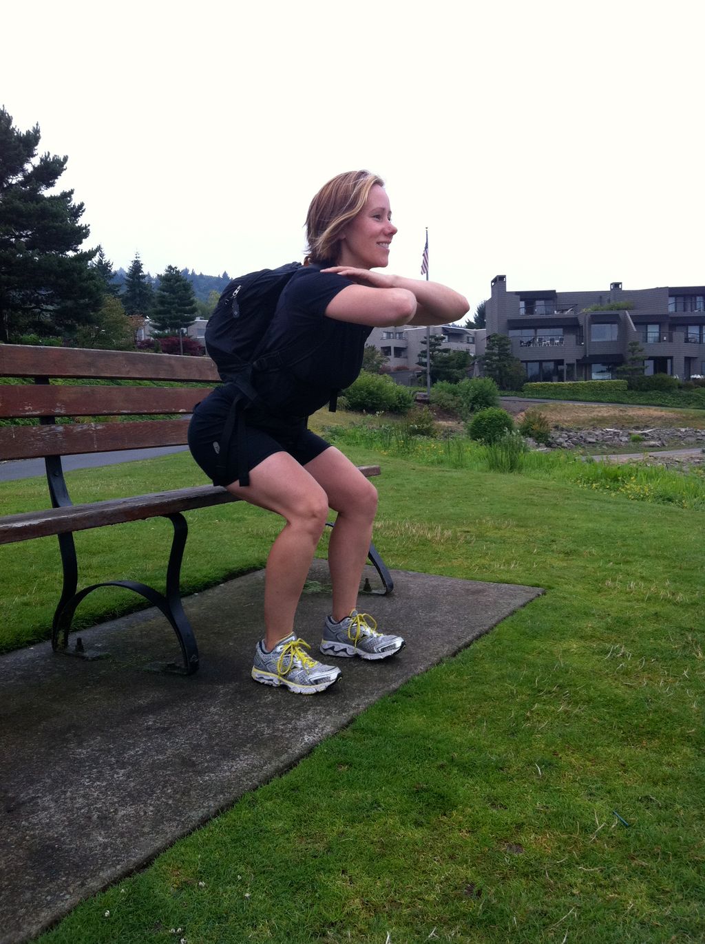 Coach Natalie demo-ing squat form for a magazine a