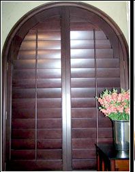 Stained basswood full louvered arch