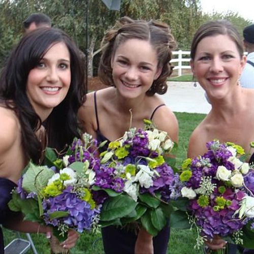 Mixed purple bridesmads bouquets.