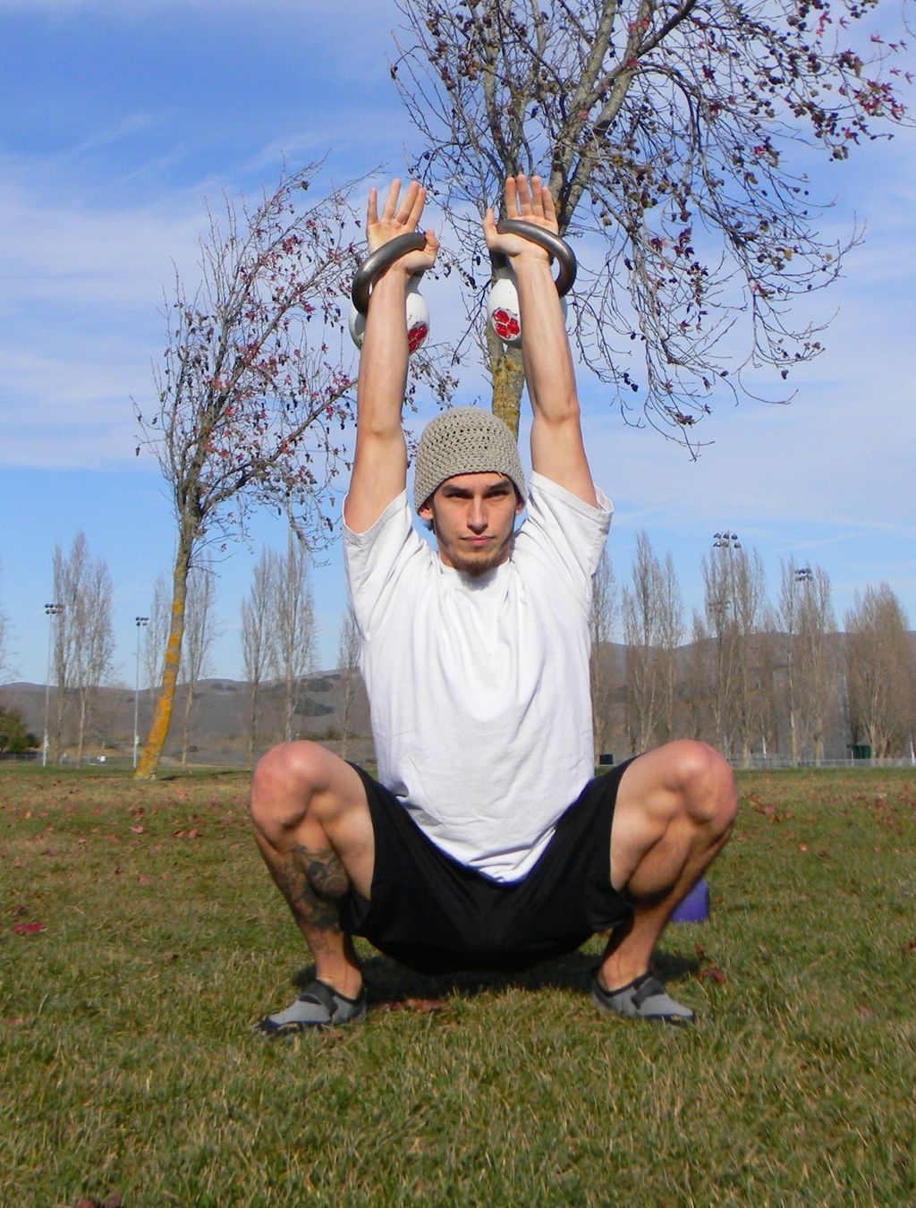 Steve doing an overhead squat with 60 lbs. This mo