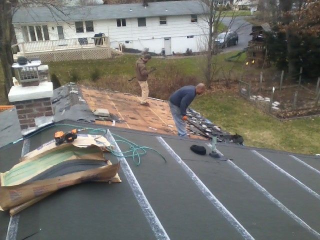 Upper roof water tight, lower roof being stripped.