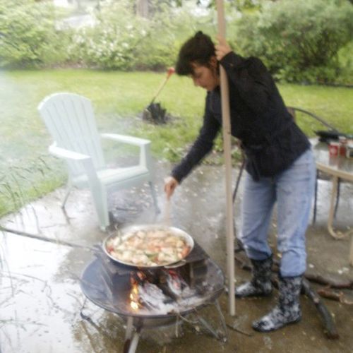Cooking over an open fire (in the pouring rain!). 