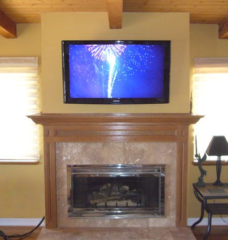 A very nice wooden fireplace improved with a 50 in