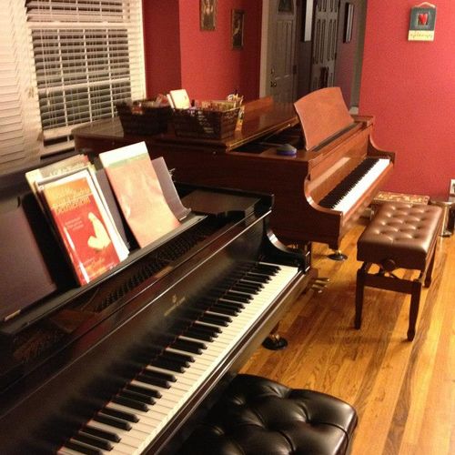 The studio is equipped with two grand pianos.  One