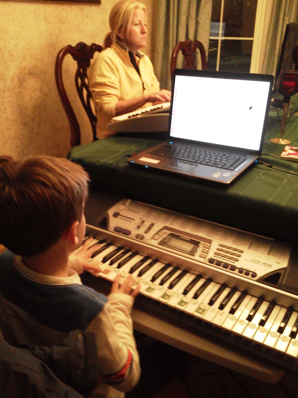 Mother and son working intently.