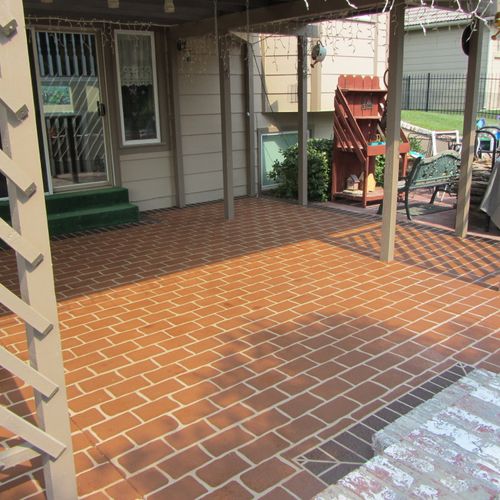 Concrete patio after applying a brick overlay