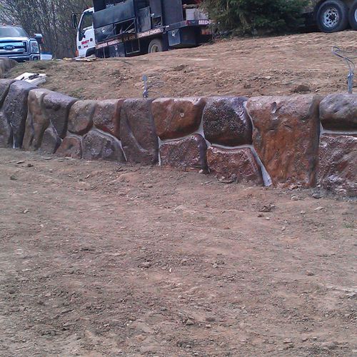 concrete stained retaining wall cut up into stone 