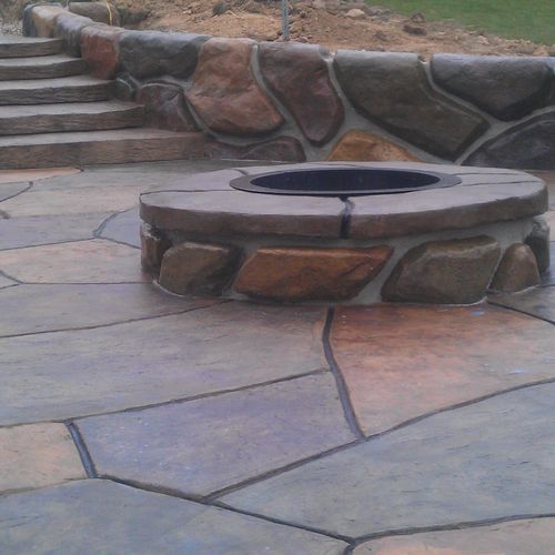 Hand carved concrete stone fire pit and retaining 