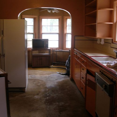 The outdated kitchen with a view into the family d