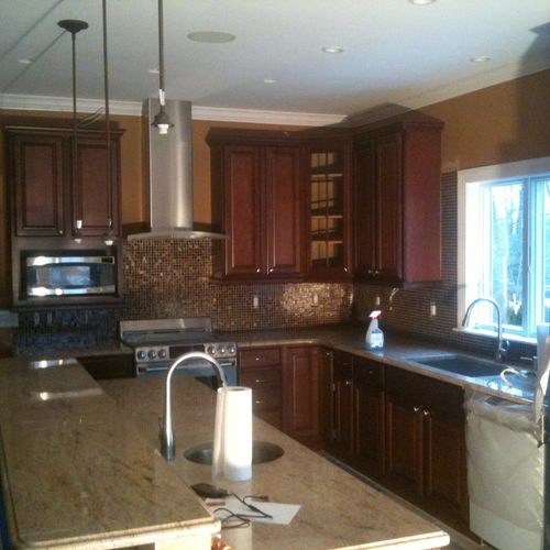 New custom kitchen with granite counters and bronz