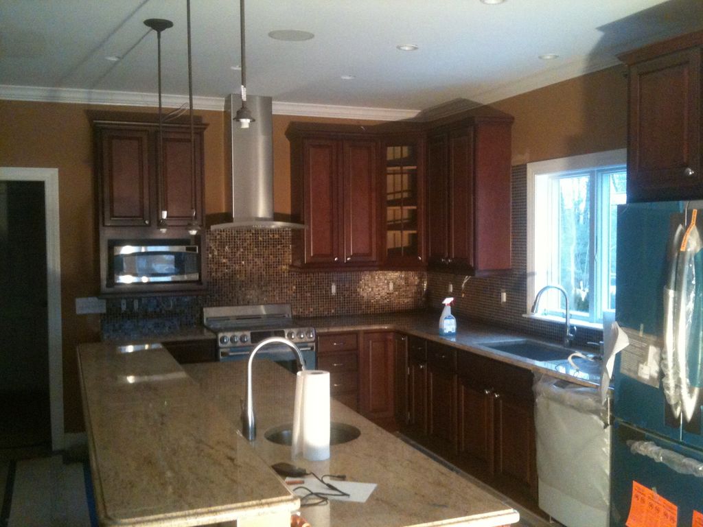 New custom kitchen with granite counters and bronz