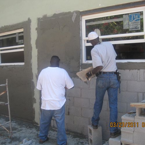 Plastering the masonry wall..