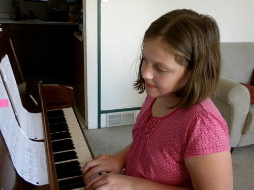 Hannah playing "Can You Feel the Love Tonight"