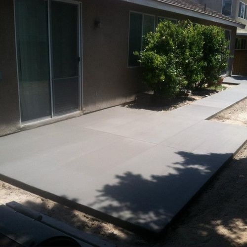 Two Concrete Patios connected by Sidewalk in Eastv