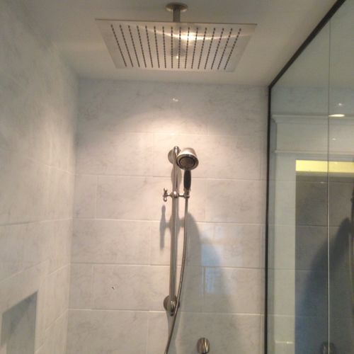 custom tile walk in shower with rain head and hand