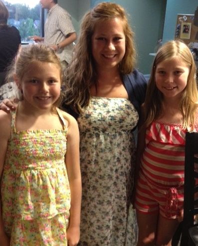 Carly with two of her students after a performance