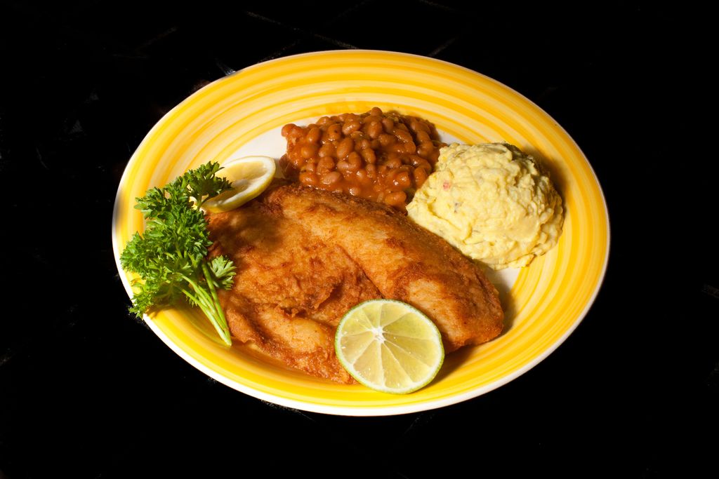 Fried tilapia, baked beans, and potato salad, all 