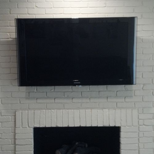 52 inch Flat Panel over fireplace.