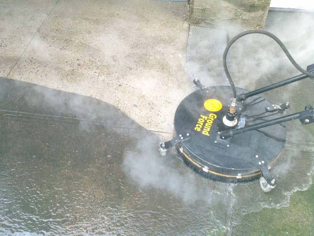Steam cleaning drive way.oil grease removal