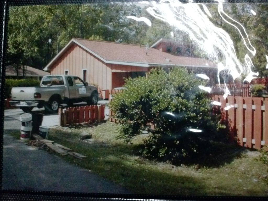 We added trim and painted this home and fence in P