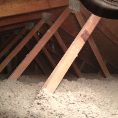 10 inches of cellulose insulation blown-in over th