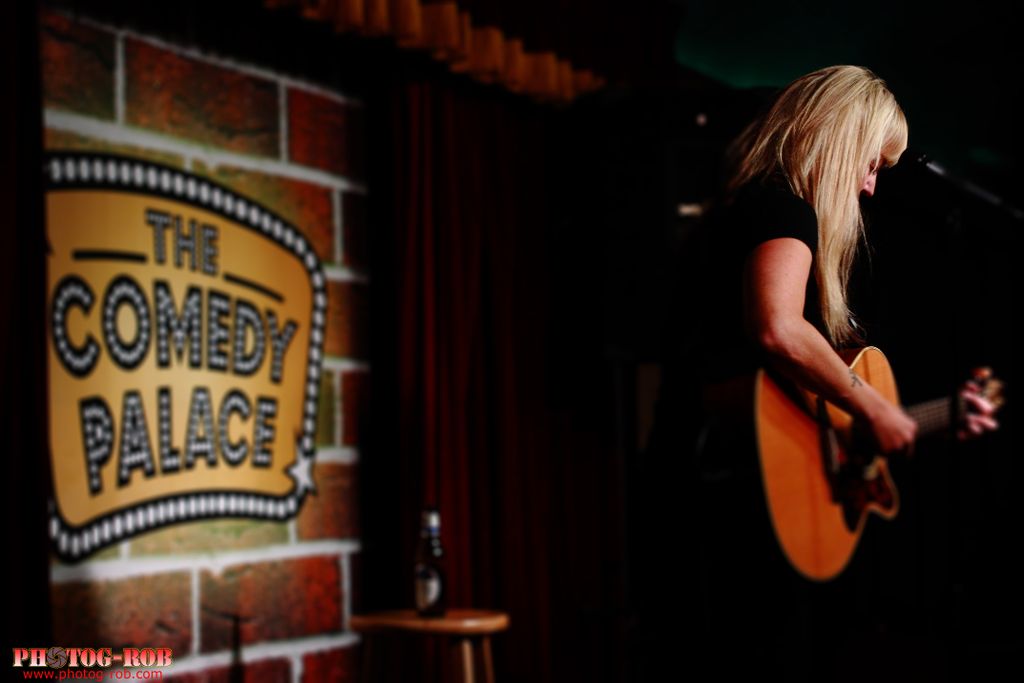 Shot of Alison Gill, hilarious comic on stage at T