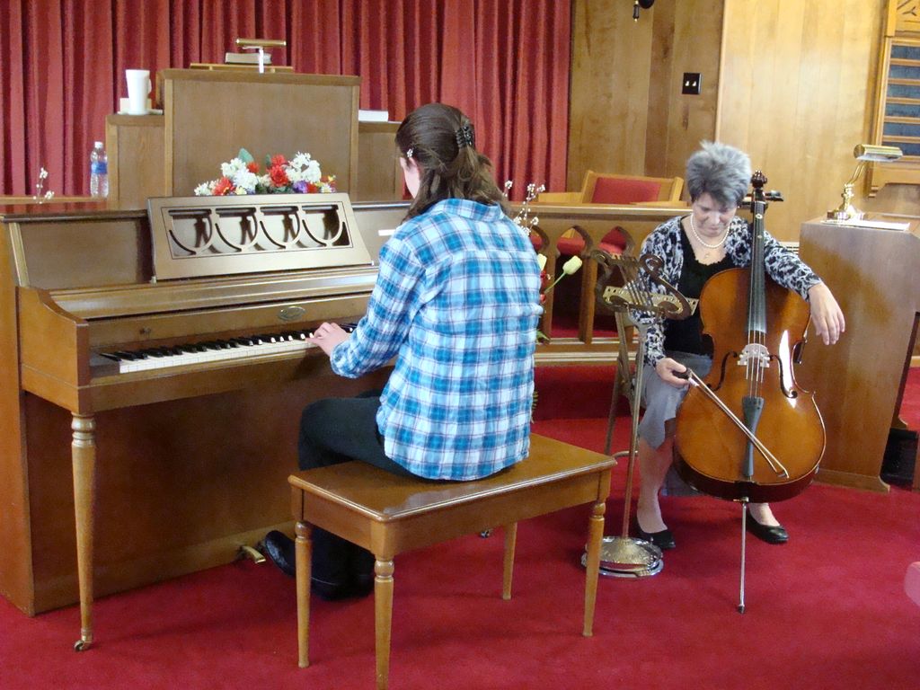 A piano student and a cello student warming up for