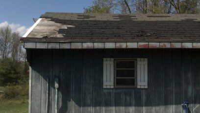 before picture of siding and roof of old barn....