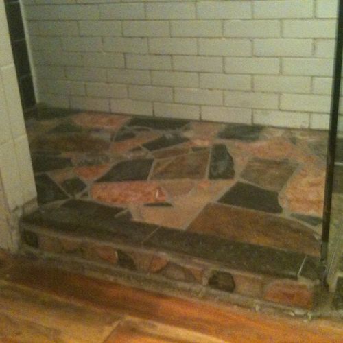 An interesting shower floor of granite, marble and