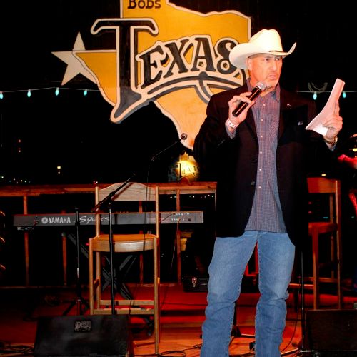 On stage MC'ing an event at Billy Bob's Texas