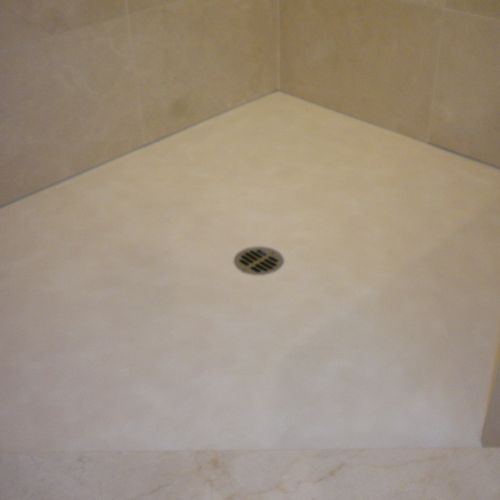 Custom colored concrete shower floor.
Matches the 