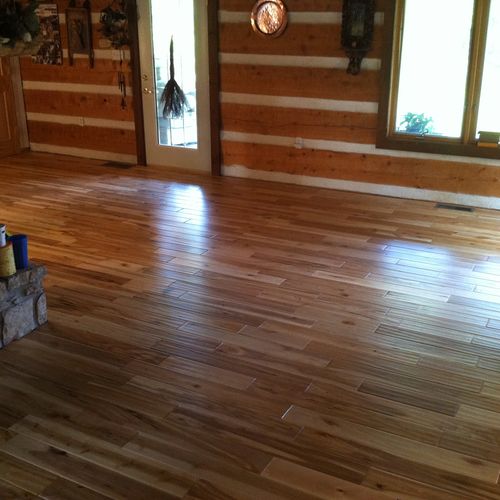 Hand scraped solid wood floor at a rustic cabin re