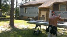 Back of House while applying insulation to recieve
