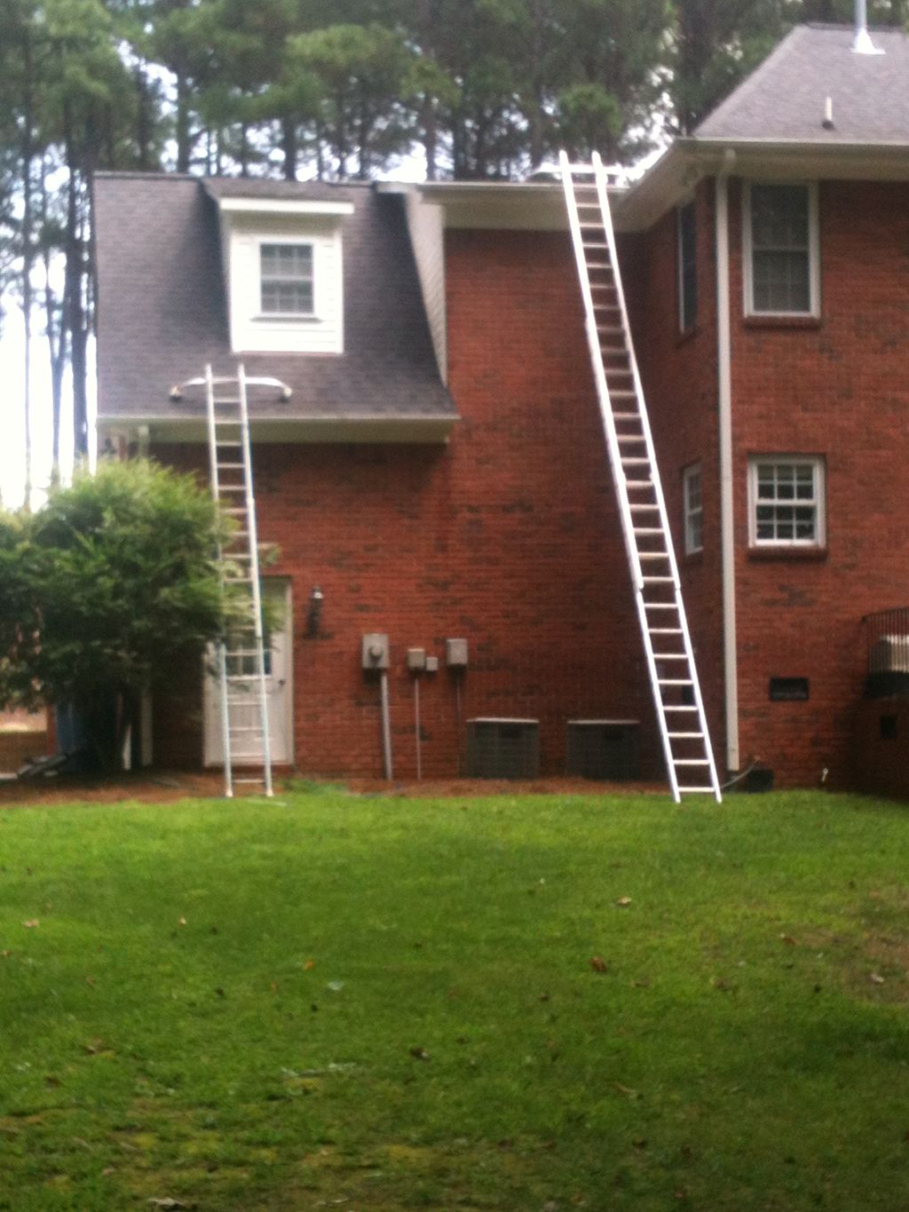 Cleaning gutters, glad were not afraid of heights
