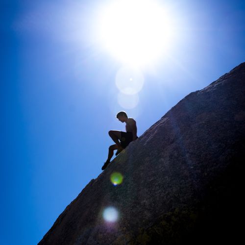 A rock climber descending from a route in Bishop, 