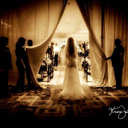 Bride entering ceremony at the Ritz Carlton