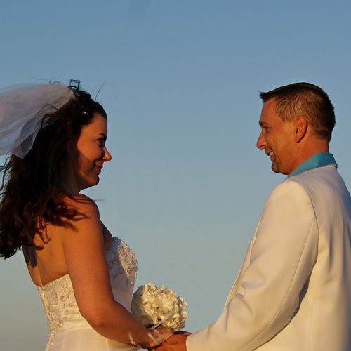 Wedding shot on the beach front. Sunset made for s