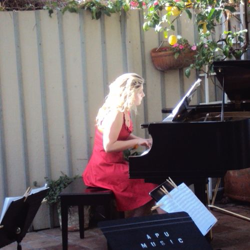 Berenika at the garden party fundraiser playing th