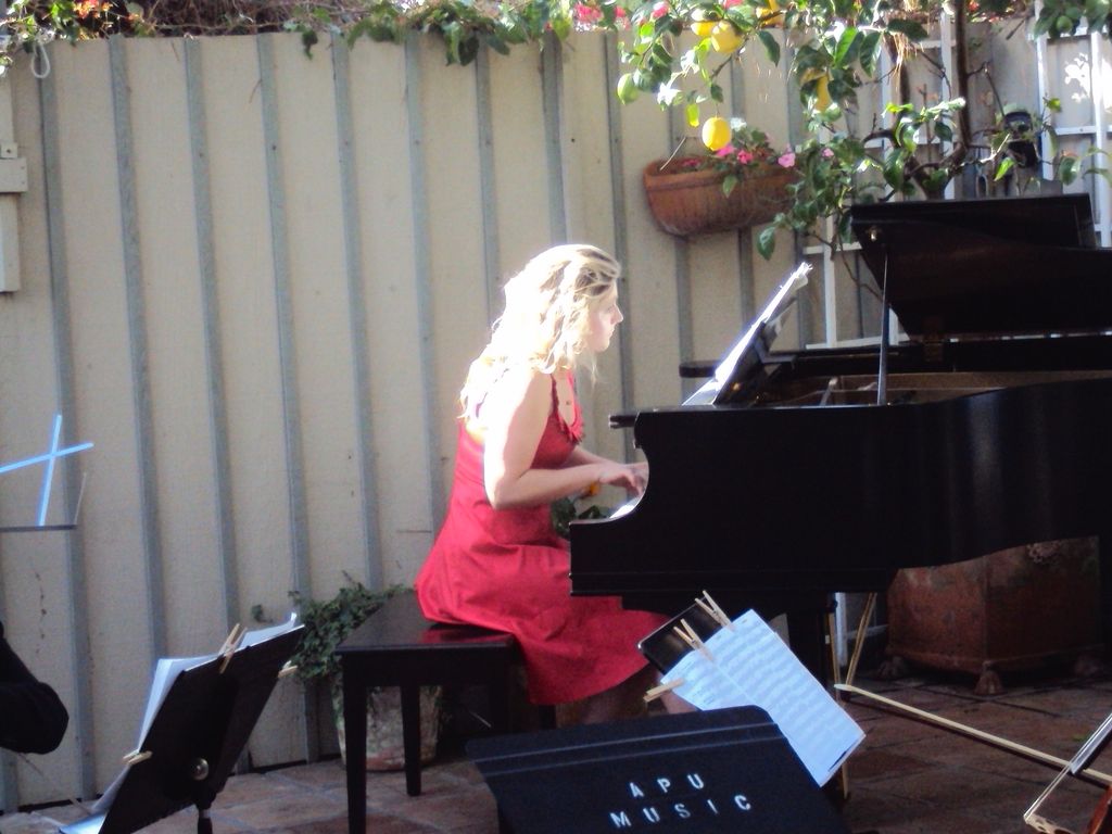 Berenika at the garden party fundraiser playing th