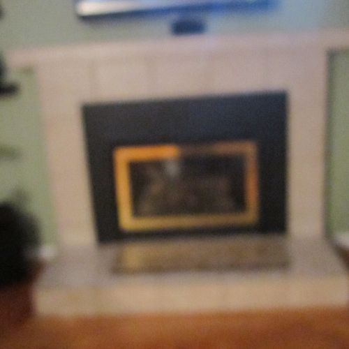 Reface an existing red brick fireplace to a modern