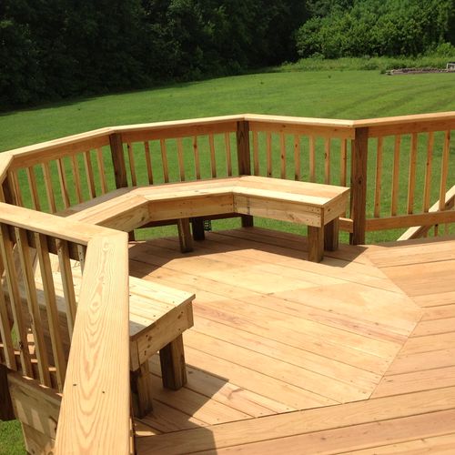 Part of a 450sf deck with built-in seating. 
Frede