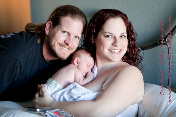 4 day old infant's first day at home with his pare