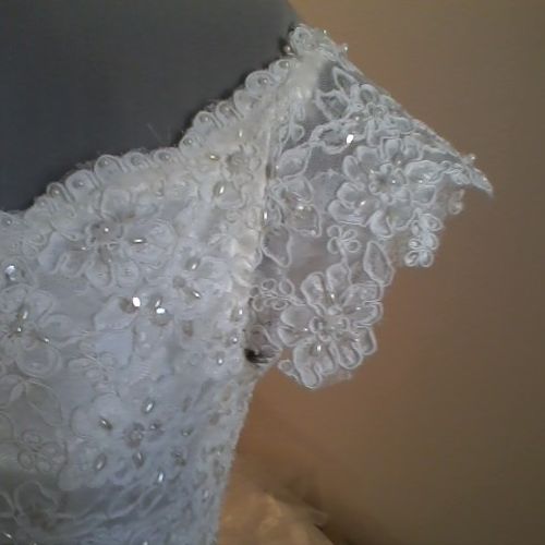 Hand-pieced and sewn lace, hand-sewn onto bodice o