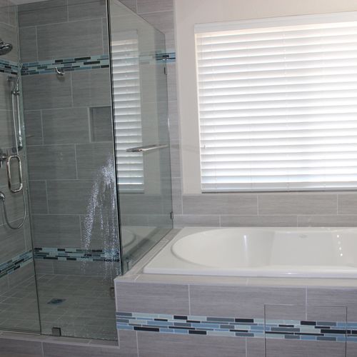 Custom bathroom will fully tiled shower and tub su