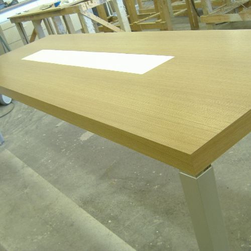 Oak dining table with corian hotplate inserts.
www
