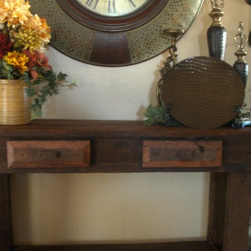This sofa table is made of 140 year old barn wood.