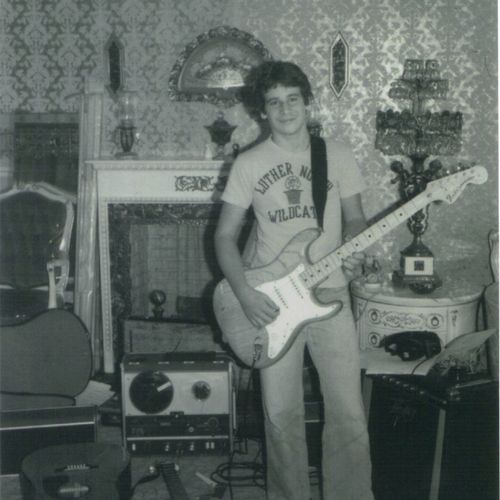 A young Ernie 1977, with Fender Stratocaster in ha