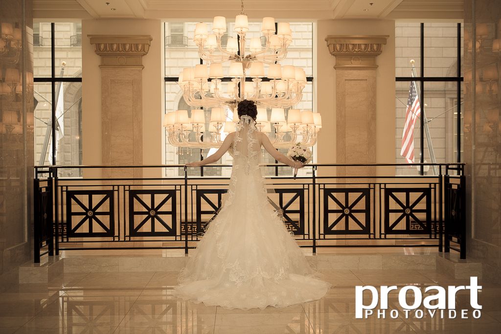 Beautiful bride on the balcony of JW Marriott Hote