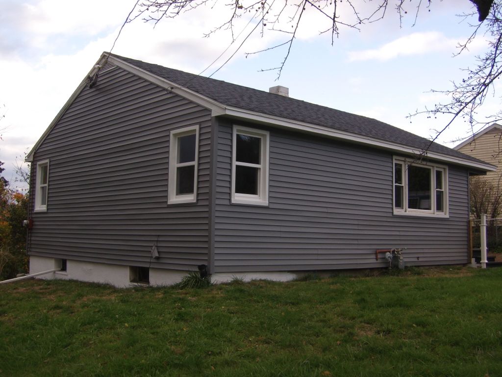 vinyl siding, roofing, and window job we did in hi
